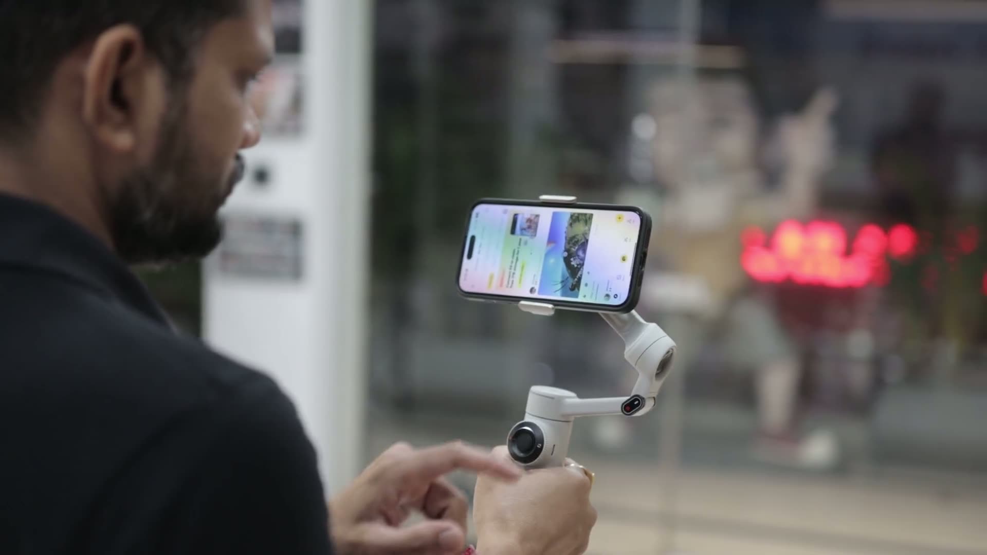 A phone on a gimbal filming a scene