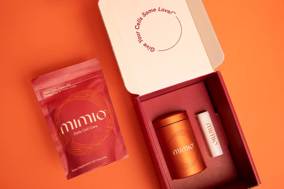 Mimio Health: the red pouch and canister in an open gift box on orange