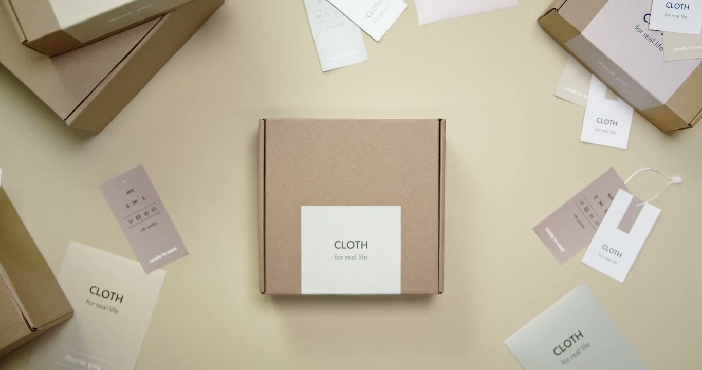Hands holding up a labelled shipping box