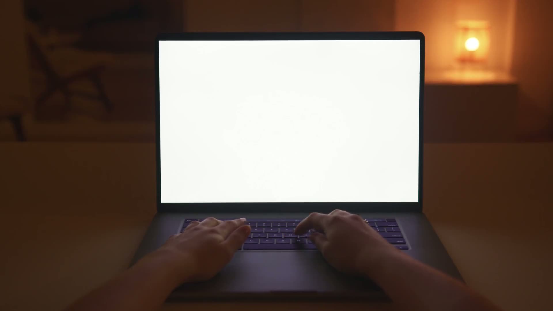 Hands typing a question on a laptop