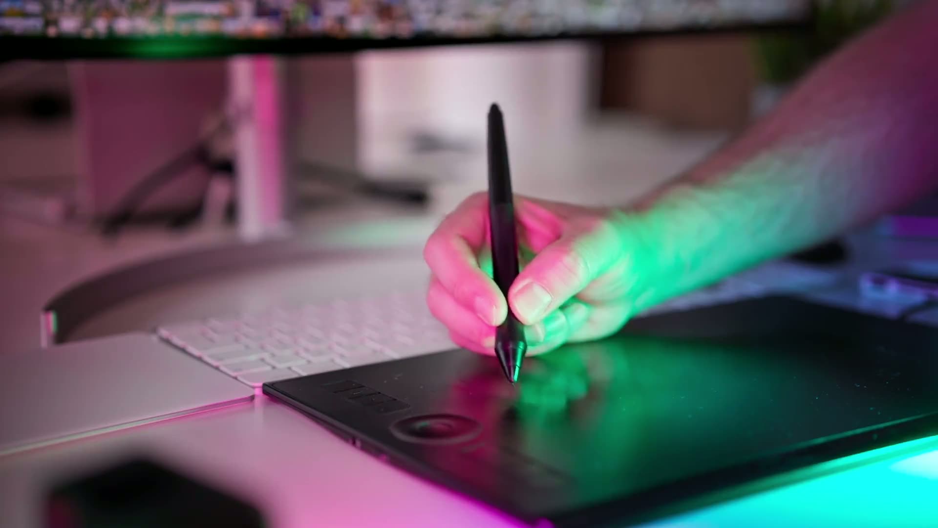 A designer editing photos in a home studio